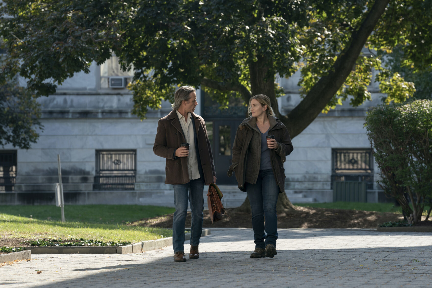 Guy Pearce, left, and Kate Winslet in HBO's "Mare of Easttown."